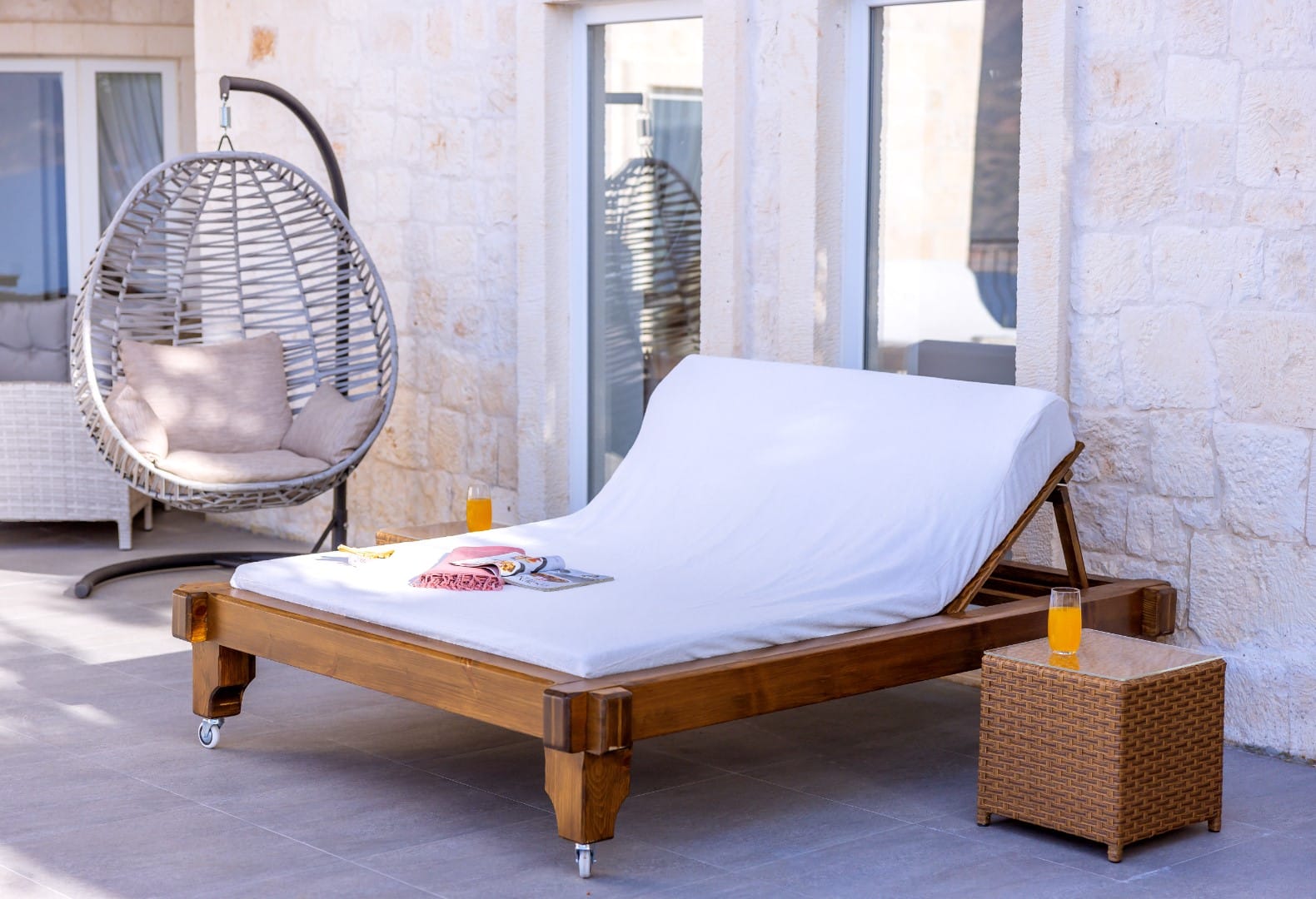 Charming outdoor dining area on the poolside terrace overlooking the sea